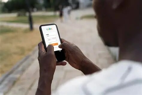 A man checking a login screen on his phone